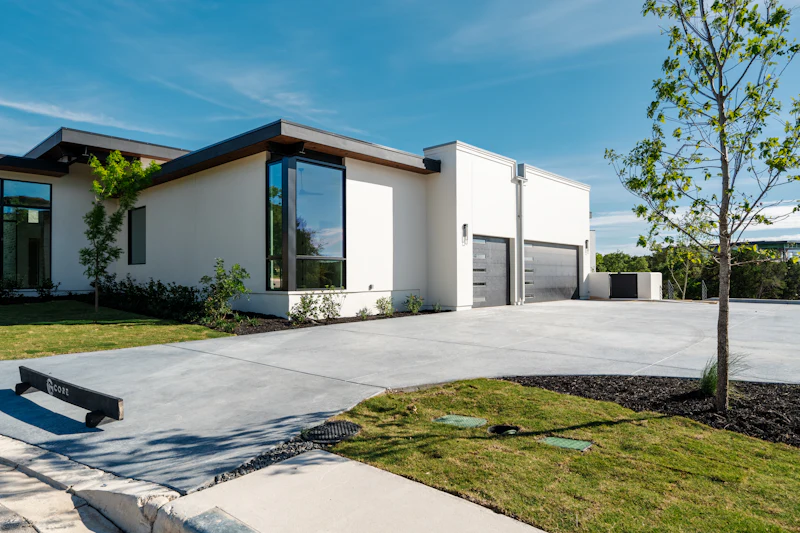 Wide new concrete driveway at a modern home